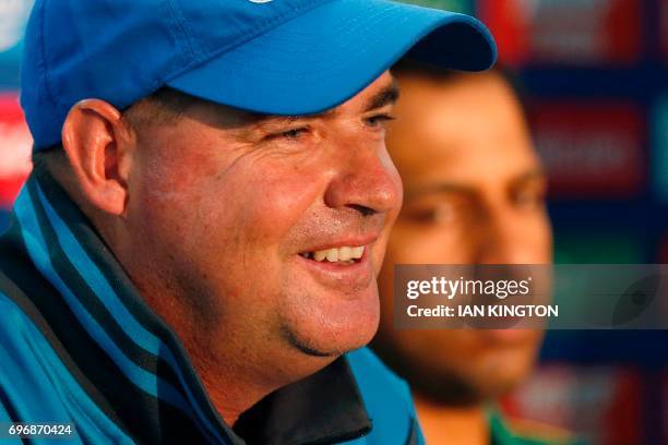 Pakistan's coach Mickey Arthur and Pakistan's captain Sarfraz Ahmed attend a press conference folling a nets practice session at The Oval in London...