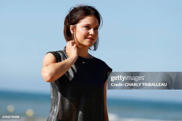 French actress Audrey Bastien poses during a photocall on June 16, 2017 during the Cabourg Romantic Film Festival in Cabourg, northwestern France. /...