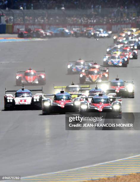Britain's driver Mike Conway competes on his Toyota TS050 Hybrid N°7, ahead of Switzerland's driver Sebastien Buemi on his Toyota TS050 Hybrid N°8...