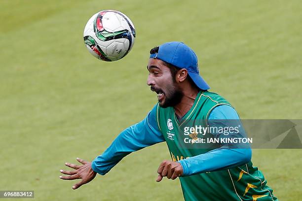 Pakistan's Mohammad Amir plays footbal during a nets practice session at The Oval in London on June 17 on the eve of the ICC Champions Trophy Final...