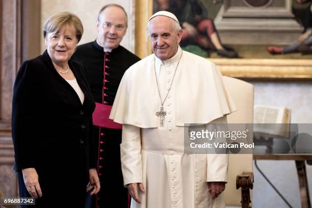 Pope Francis meets German Chancellor Angela Merkel at his private library in the Apostolic Palace on June 17, 2017 in Vatican City, Vatican. During...