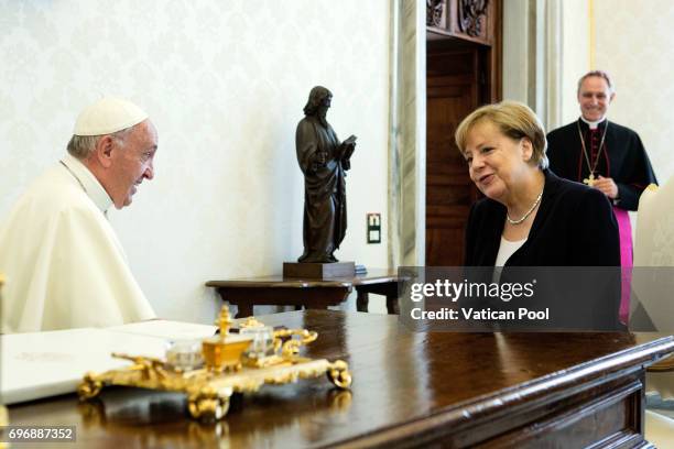 Pope Francis meets German Chancellor Angela Merkel at his private library in the Apostolic Palace on June 17, 2017 in Vatican City, Vatican. During...