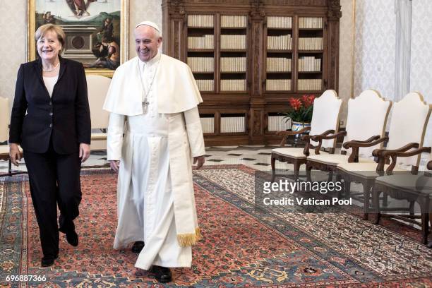 Pope Francis meets German Chancellor Angela Merkel at his private library in the Apostolic Palace on June 17, 2017 in Vatican City, Vatican. During...