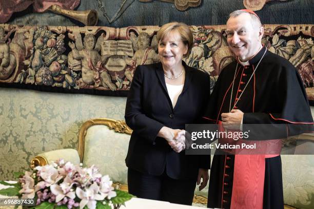 Angela Merkel meets Vatican Secretary of State Cardinal Pietro Parolin after a meeting with Pope Francis at his private library in the Apostolic...