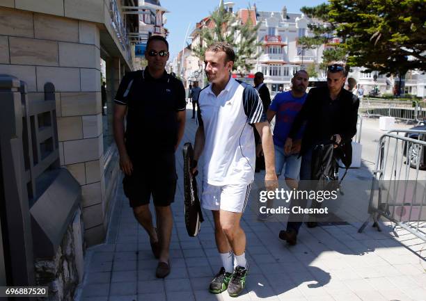 French President Emmanuel Macron dressed in tennis player returns to his house on the eve of the second round of the French parliamentary elections...