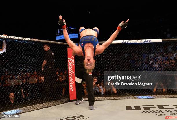 Holly Holm celebrates after her knockout victory over Bethe Correia of Brazil in their women's bantamweight bout during the UFC Fight Night event at...