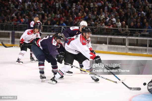 Adam Cracknell of Canada shoots for goal during the Ice Hockey Classic between the United States of America and Canada at Qudos Bank Arena on June...