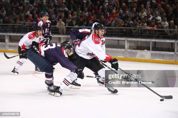 Adam Cracknell of Canada shoots for goal during the Ice Hockey Classic between the United States of America and Canada at Qudos Bank Arena on June...