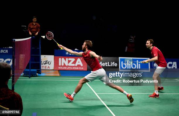 Mathias Boe and Carsten Mogensen of Denmark compete against Fajar Alfian and Muhammad Rian Ardianto of Indonesia during Mens Double Semifinal match...