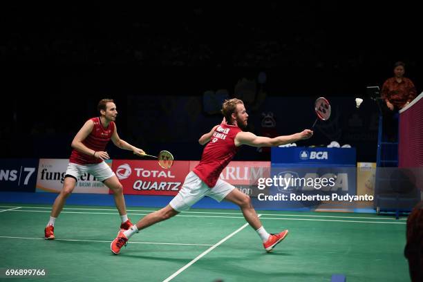 Mathias Boe and Carsten Mogensen of Denmark compete against Fajar Alfian and Muhammad Rian Ardianto of Indonesia during Mens Double Semifinal match...