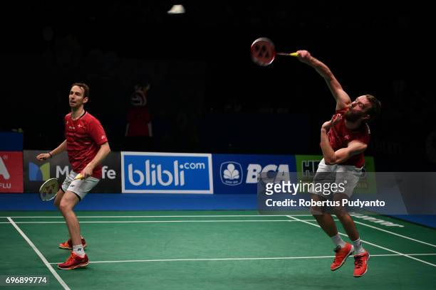 Mathias Boe and Carsten Mogensen of Denmark compete against Fajar Alfian and Muhammad Rian Ardianto of Indonesia during Mens Double Semifinal match...