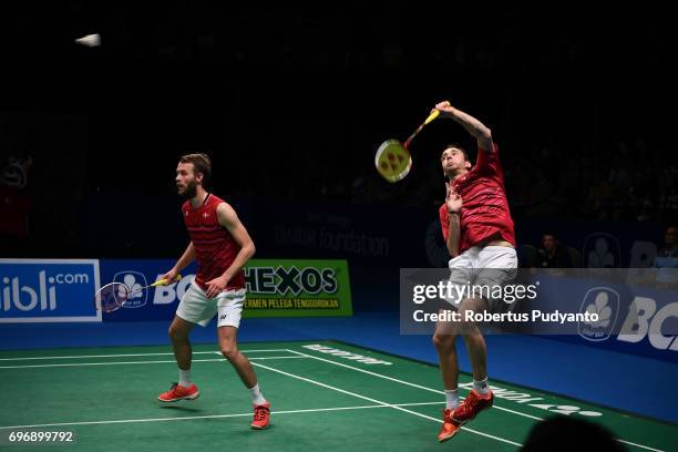 Mathias Boe and Carsten Mogensen of Denmark compete against Fajar Alfian and Muhammad Rian Ardianto of Indonesia during Mens Double Semifinal match...