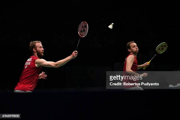 Mathias Boe and Carsten Mogensen of Denmark compete against Fajar Alfian and Muhammad Rian Ardianto of Indonesia during Mens Double Semifinal match...