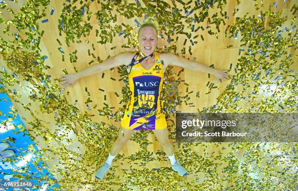 Laura Langman of the Lightning celebrates victory amongst the confetti after winning the Super Netball Grand Final match between the Lightning and...