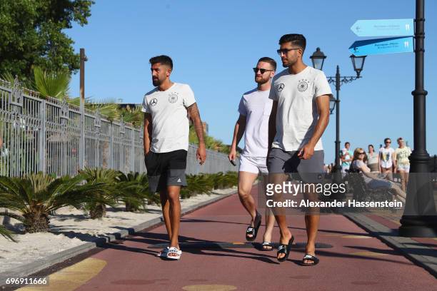 Kerem Demirbay, Shkodran Mustafi and Emre Can of the German national team walks outside the team hotel Radisson Blu Paradise Resort & Spa at Adler...