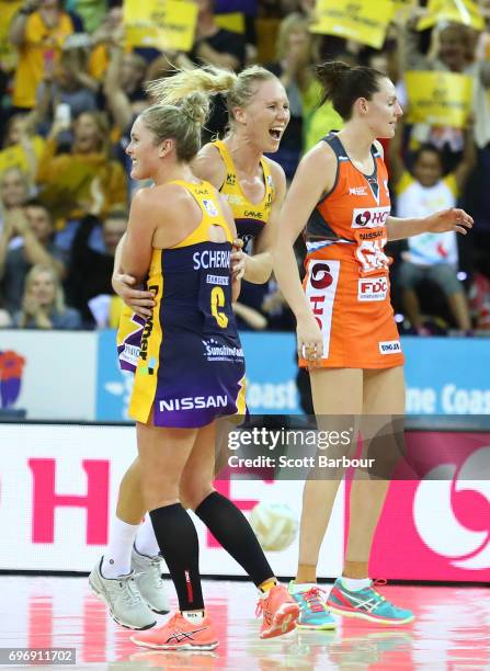 Laura Langman and Laura Sherian celebrate victory with their teammates at the final whistle during the Super Netball Grand Final match between the...