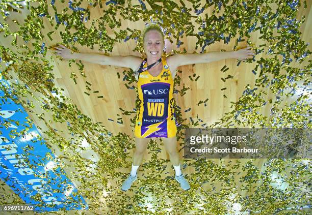 Laura Langman of the Lightning celebrates victory amongst the confetti after winning the Super Netball Grand Final match between the Lightning and...