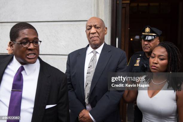 Actor and comedian Bill Cosby looks on as his publicist Andrew Wyatt addresses the media outside the Montgomery County Courthouse on June 17, 2017 in...