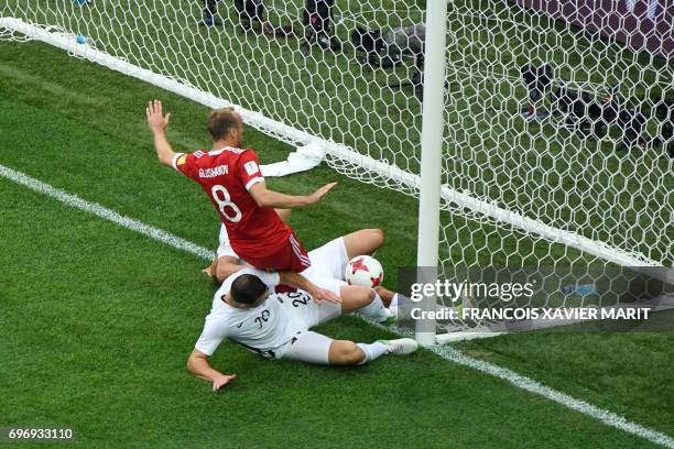 Russia's midfielder Denis Glushakov scores the first goal of the match during the 2017 Confederations Cup group A football match between Russia and...