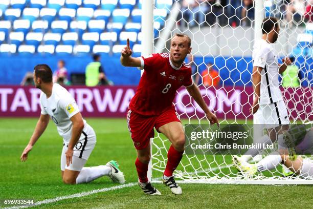 Denis Glushakov of Russia celebrates scoring the opening goal during the FIFA Confederations Cup Group A match between Russia and New Zealand at...