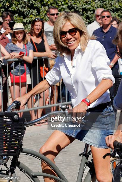 Wife of French President Emmanuel Macron, Brigitte Trogneux leaves her home on a bicycle on the eve of the second round of the French parliamentary...