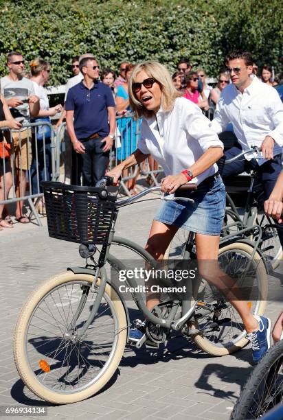 Wife of French President Emmanuel Macron, Brigitte Trogneux leaves her home on a bicycle on the eve of the second round of the French parliamentary...