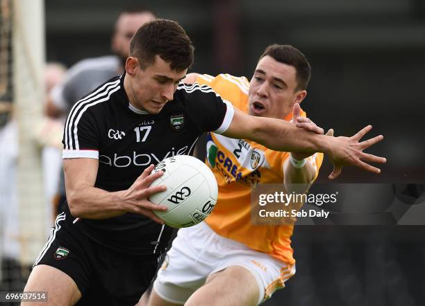 Sligo , Ireland - 17 June 2017; Niall Murphy of Sligo in action against Declan Lynch of Antrim during the GAA Football All-Ireland Senior...