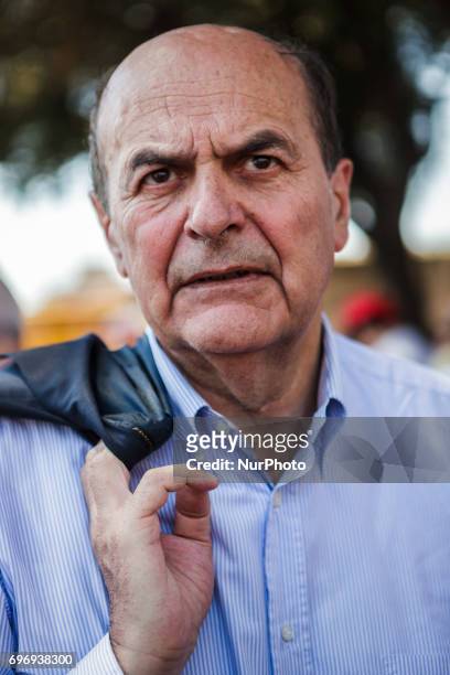 Pierluigi Bersani attends a demonstration to protest against the reintroduction of a new type of work 'voucher' system, coupons to pay jobs for less,...