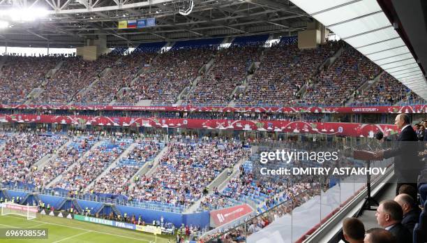 Russian President Vladimir Putin addresses the crowds during the opening ceremony of the 2017 Confederations Cup group A football match between...