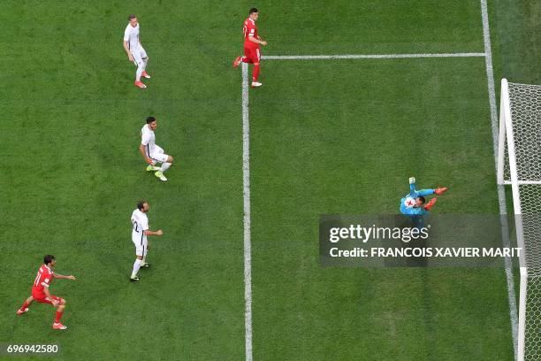 New Zealand's goalkeeper Stefan Marinovic deflects the ball during the 2017 Confederations Cup group A football match between Russia and New Zealand...