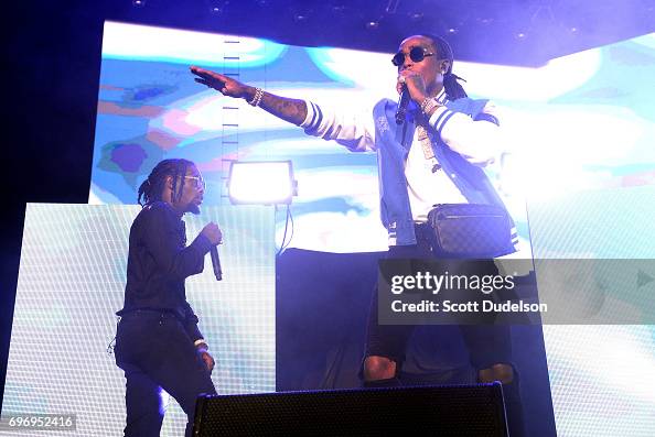 Trio Rappers Rappers Offset and Quavo of the hip hop trio Migos perform onstage ...