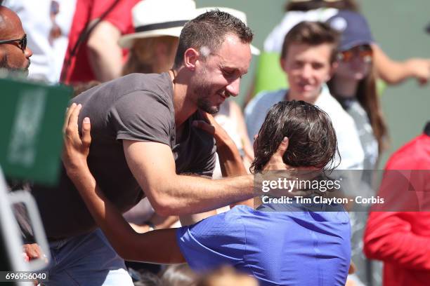 French Open Tennis Tournament - Day Fourteen. Alexei Popyrin of Australian celebrates with his team after defeating Nicola Kuhn of Spain to win the...