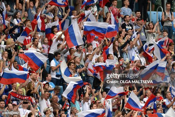 Russia supporters cheer during the 2017 Confederations Cup group A football match between Russia and New Zealand at the Krestovsky Stadium in...