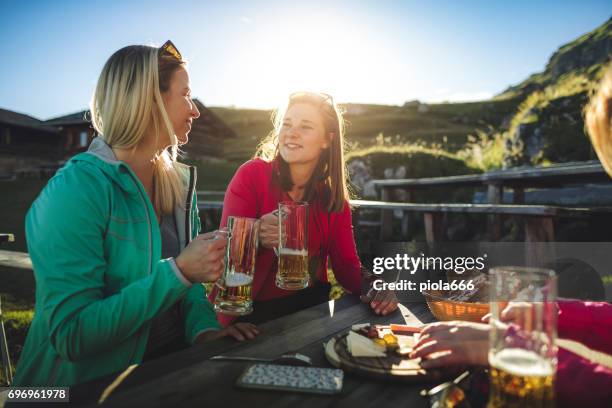 adventures on the mountain: group of women together - italy beer stock pictures, royalty-free photos & images