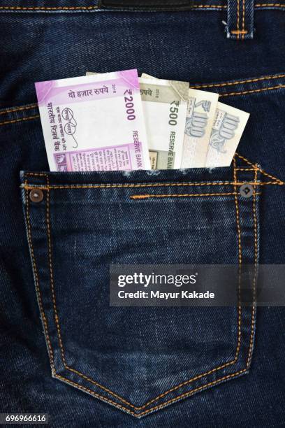 money in jeans back pocket - indian currency stock pictures, royalty-free photos & images