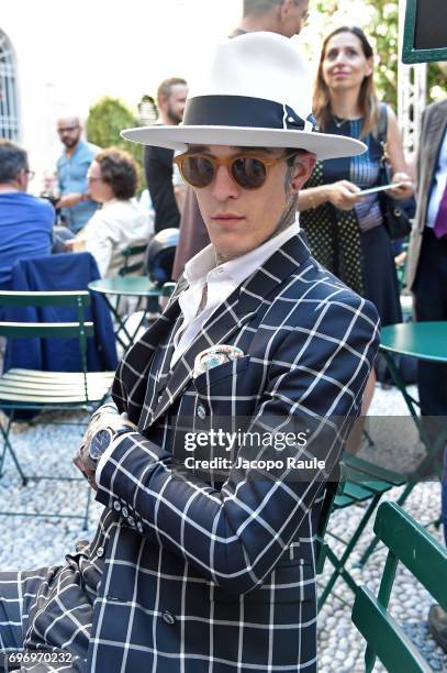 James Edward Quaintance attends the Versace show during Milan Men's Fashion Week Spring/Summer 2018 on June 17, 2017 in Milan, Italy.