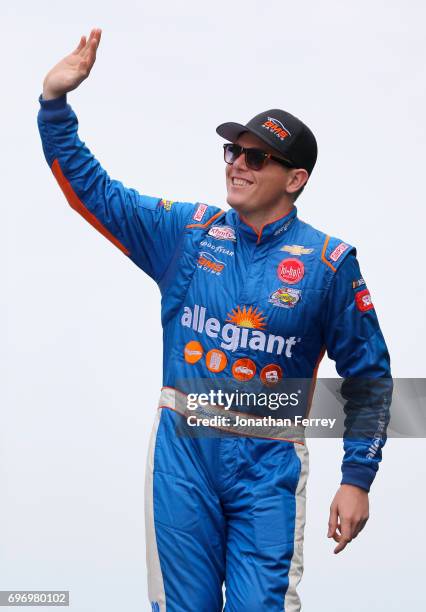 Spencer Gallagher, driver of the Allegiant Airlines Chevrolet, waves to the crowd during the NASCAR XFINITY Series Irish Hills 250 at Michigan...