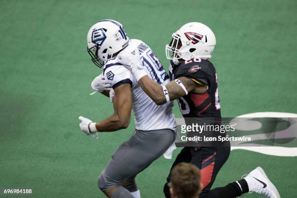 Cleveland Gladiators DB Kenny Veal tackles Baltimore Brigade WR Paul Browning during the fourth quarter of the Arena League Football game between the...