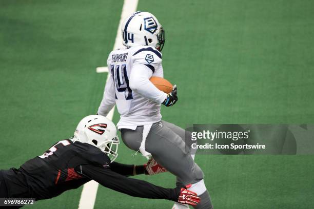 Baltimore Brigade WR Brandon Tompkins eludes the tackle attempt of Cleveland Gladiators DB Fredrick Obi as he returns a kickoff during the third...