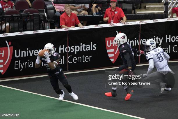 Cleveland Gladiators DB Kenny Veal intercepts a pass intended for Baltimore Brigade WR Julian Talley as Cleveland Gladiators DB Fredrick Obi defends...