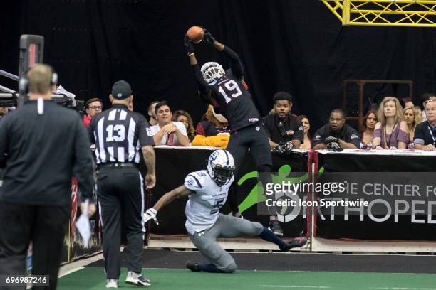 Cleveland Gladiators WR Michael Preston makes a 9-yard touchdown catch over Baltimore Brigade DB Qumain Black during the second quarter of the Arena...