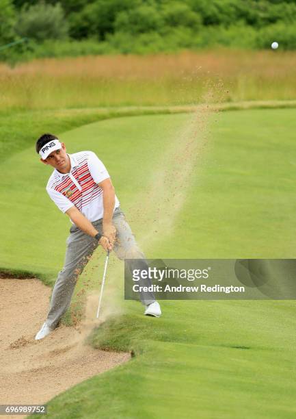 Louis Oosthuizen of South Africa plays his shot from a bunker on the 16th hole during the third round of the 2017 U.S. Open at Erin Hills on June 17,...