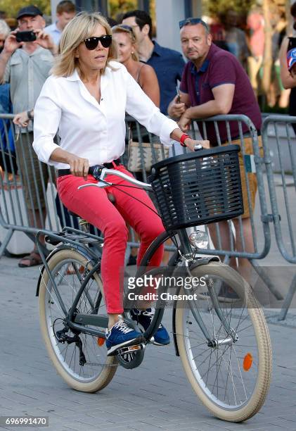 Wife of French President Emmanuel Macron, Brigitte Trogneux leaves her home on a bicycle the eve of the second round of the French parliamentary...