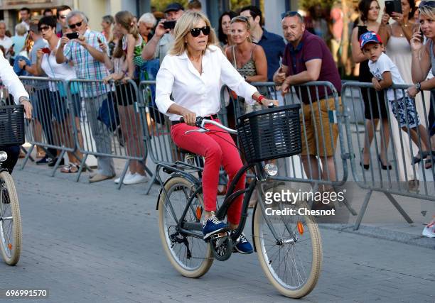 Wife of French President Emmanuel Macron, Brigitte Trogneux leaves her home on a bicycle the eve of the second round of the French parliamentary...
