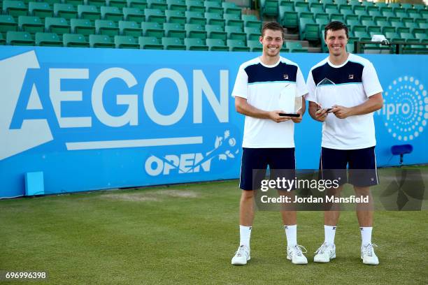 Ken Supski and Neal Skupski of Great Britain pose with their trophies after victory in their Men's Doubles Final match against Matt Reid and...
