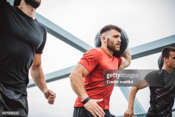 keeping each other focussed - medicine ball stock pictures, royalty-free photos & images