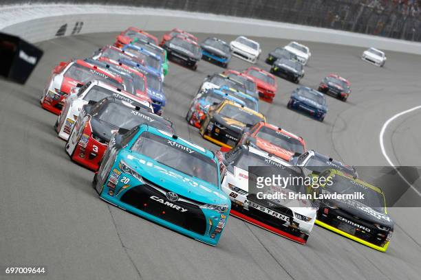 Denny Hamlin, driver of the Hisense Toyota, leads a pack of cars during the NASCAR XFINITY Series Irish Hills 250 at Michigan International Speedway...