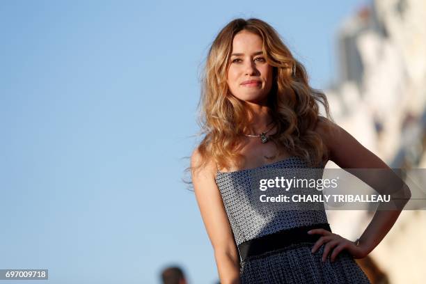 French actress Alice David poses on the red carpet on June 17, 2017 during the Cabourg Romantic Film Festival in Cabourg, northwestern France. / AFP...