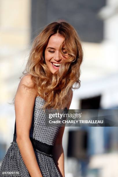 French actress Alice David poses on the red carpet on June 17, 2017 during the Cabourg Romantic Film Festival in Cabourg, northwestern France. / AFP...