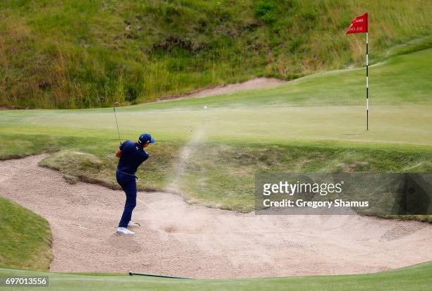 Rickie Fowler of the United States plays his shot from a bunker on the fourth hole during the third round of the 2017 U.S. Open at Erin Hills on June...